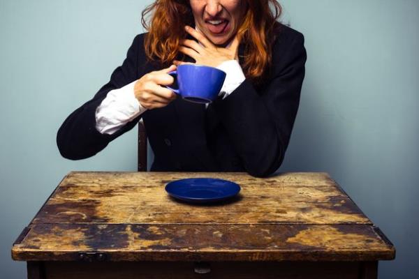 This is a photo of a businesswoman making faces after drinking a bad cup of tea. See PA Feature HEALTH Kettle. WARNING: This picture must only be used to accompany PA feature HEALTH Kettle.